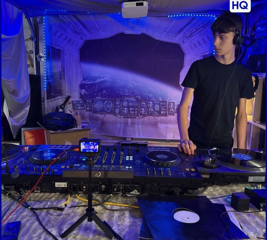 At the decks in front of the space-station backdrop, mid set.