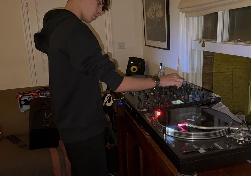 Hands on the mixer, working.